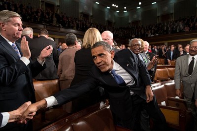 President Barack Obama reaches to shake hands with a Member of Congress as he arrives to deliver the State of the Union address at the U.S. Capitol in Washington, D.C., Feb. 12, 2013.(Official White House Photo by Pete Souza)