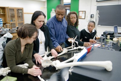 Students at Bronx Community College examine a human skeleton. (Photo by Ryan Brenzier)